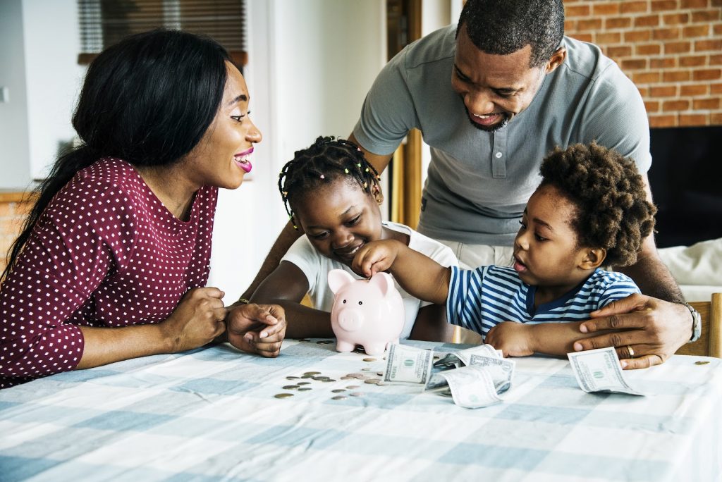 small family talking about  savings and investments