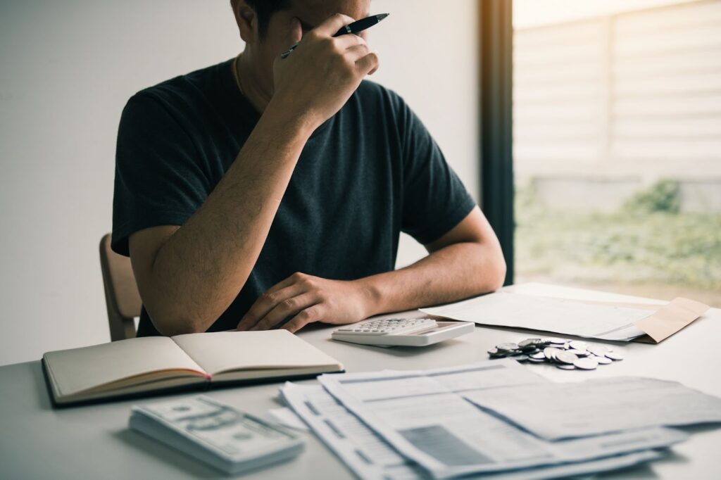 man worrying about his finances