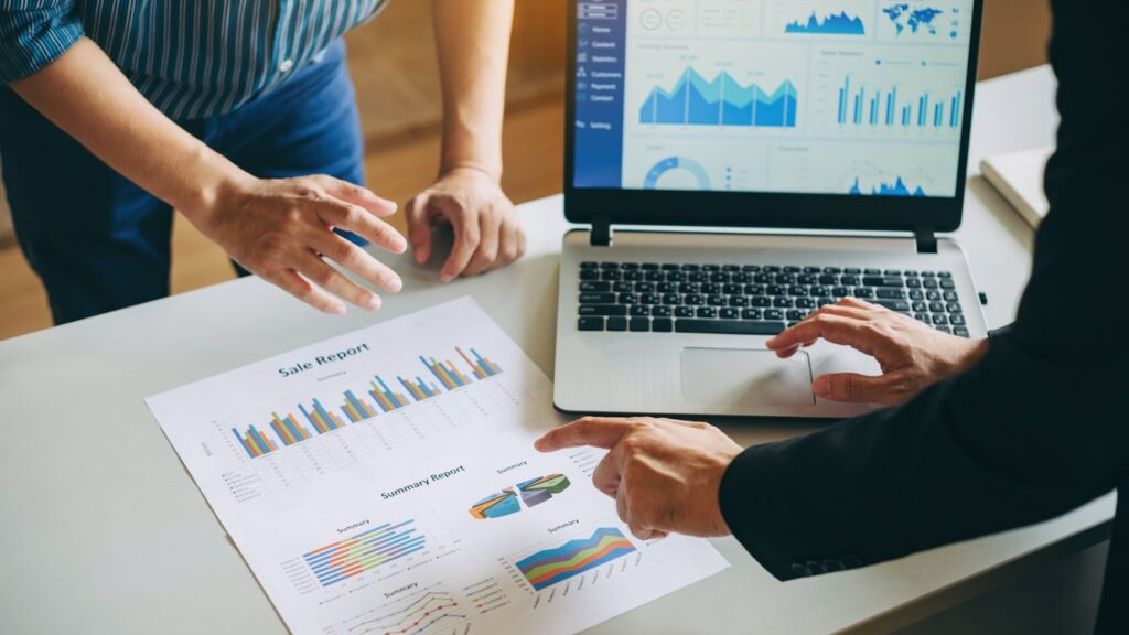 Business owner and his accountant going through financial reports 