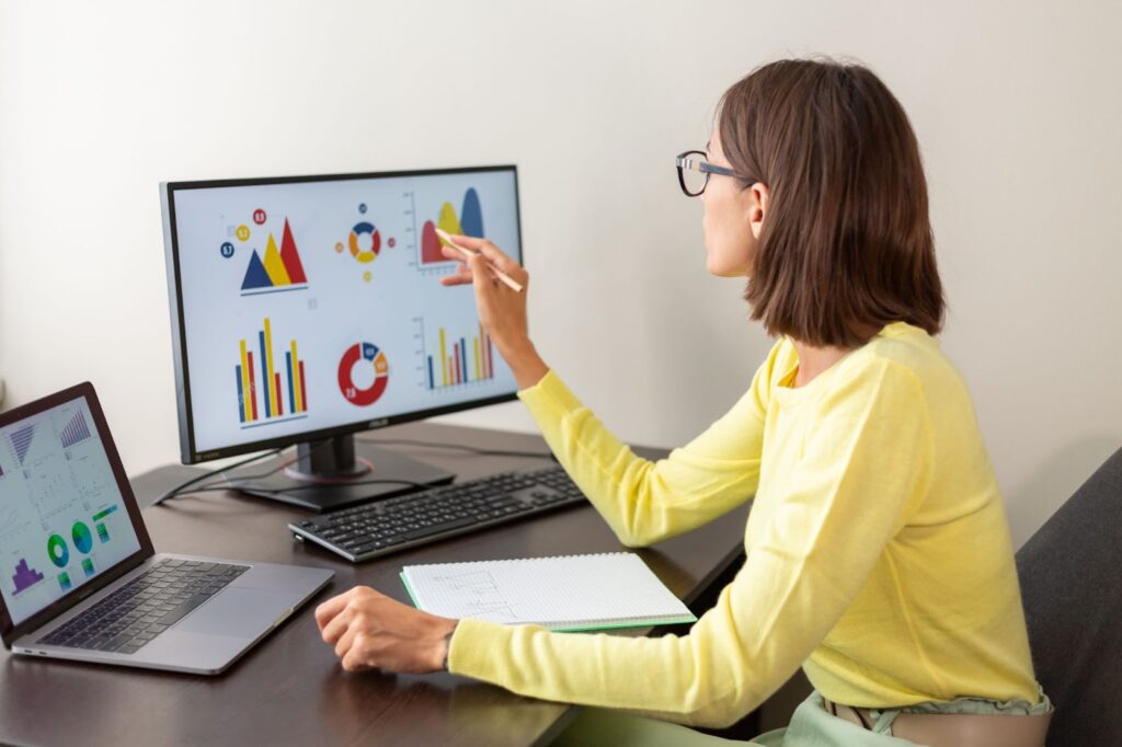 an employee analysing business stats