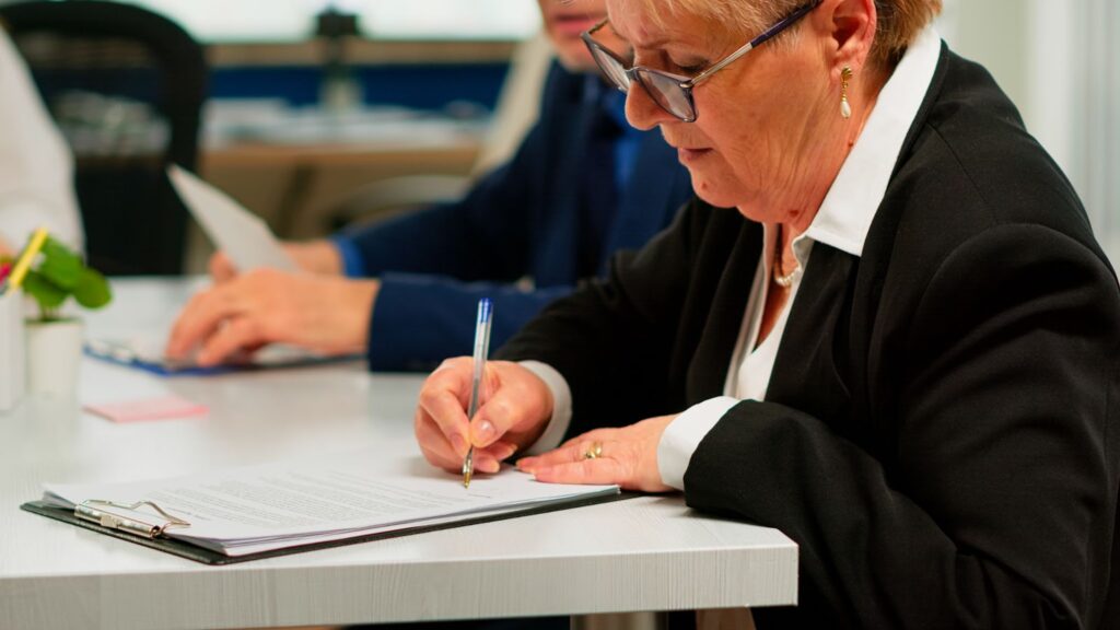 A woman reviewing contracts