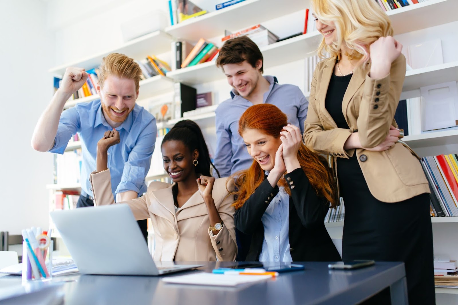 Employees celebrating after winning an office game