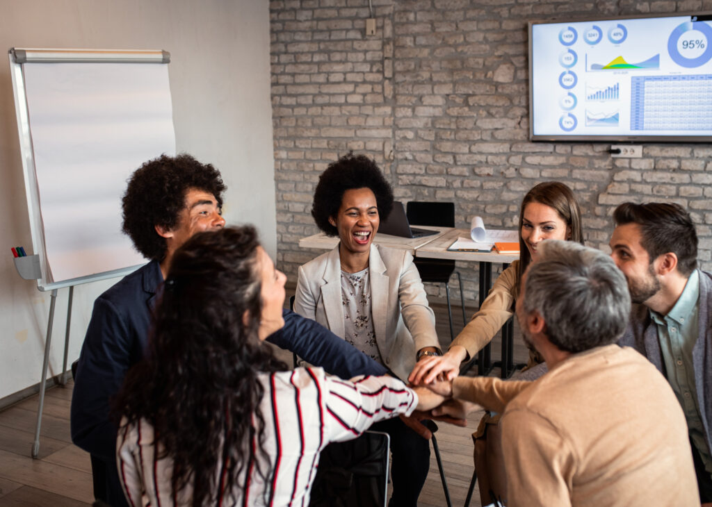 Group of diverse group of business people having a meeting while sitting in circle.
